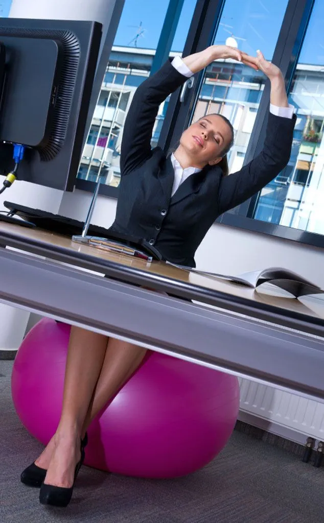 Professional using integrated wellness tools at desk